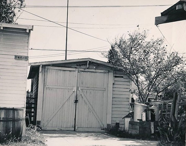 The original Walt Disney garage with its doors open, revealing a drawing desk